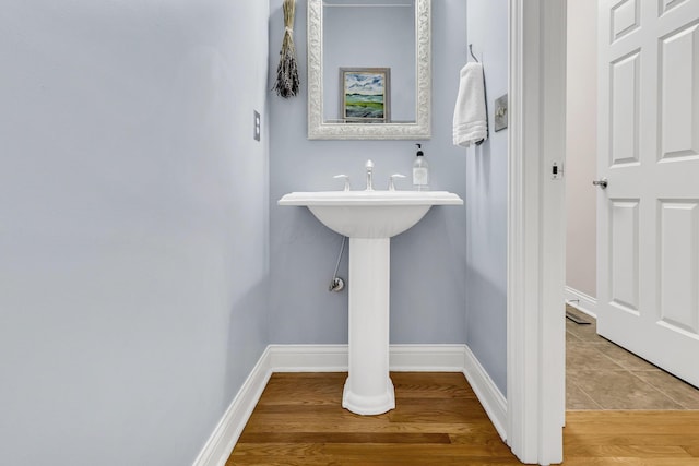 bathroom with wood-type flooring