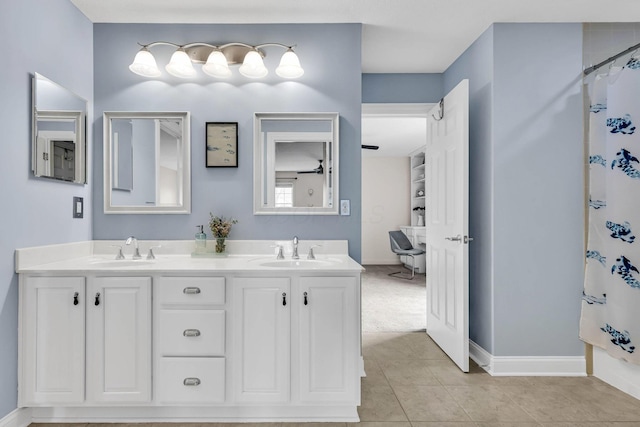 bathroom with vanity, curtained shower, and tile patterned floors