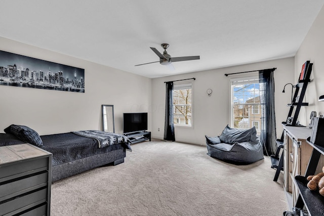 carpeted bedroom featuring ceiling fan