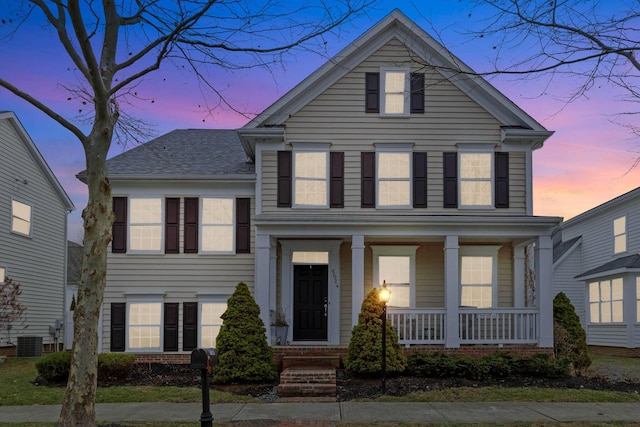 view of front of house with central AC and covered porch