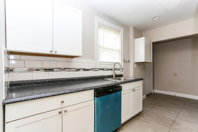 724 S Eureka Ave, Columbus, OH 43204 - kitchen featuring dishwashing machine, dark countertops, backsplash, light tile patterned flooring, and white cabinetry