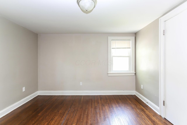 724 S Eureka Ave, Columbus, OH 43204 - unfurnished room with dark wood-type flooring and baseboards