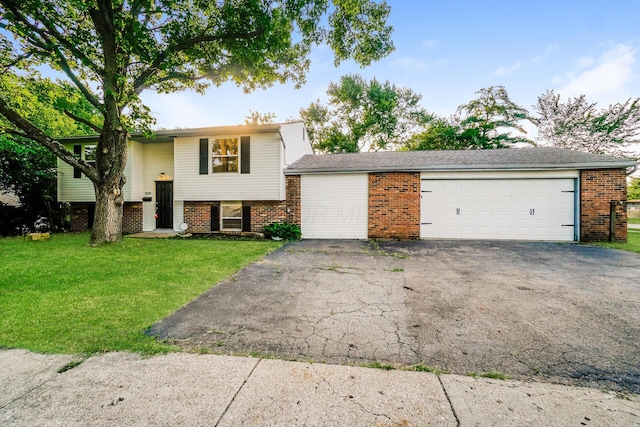 view of front facade with a front lawn and a garage