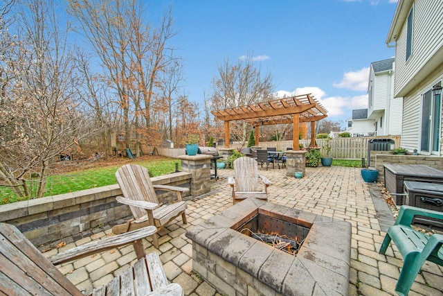 view of patio featuring a pergola and a fire pit