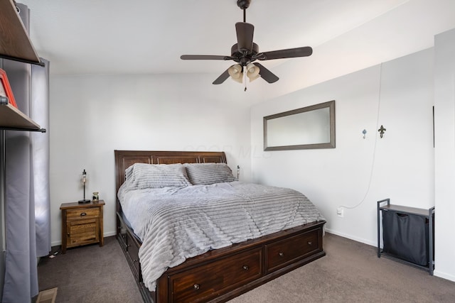 bedroom featuring dark carpet, ceiling fan, and lofted ceiling