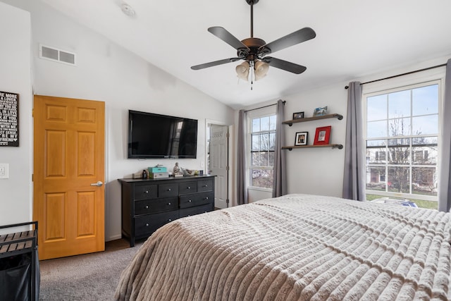 bedroom with carpet floors, multiple windows, lofted ceiling, and ceiling fan