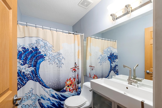 bathroom with sink, toilet, a textured ceiling, and walk in shower