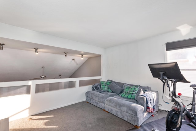 carpeted living room featuring vaulted ceiling and ceiling fan