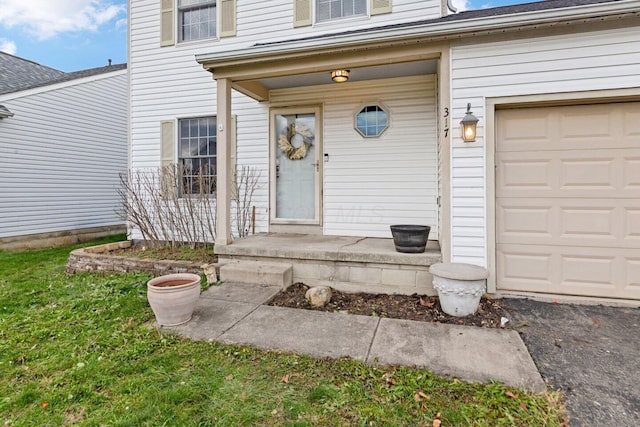 doorway to property with a garage