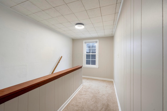 hallway with light colored carpet