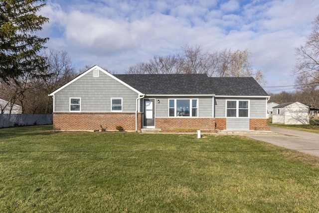 ranch-style house featuring a front lawn