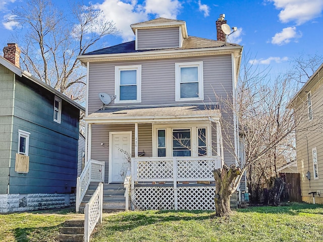 front of property with a front yard and a porch