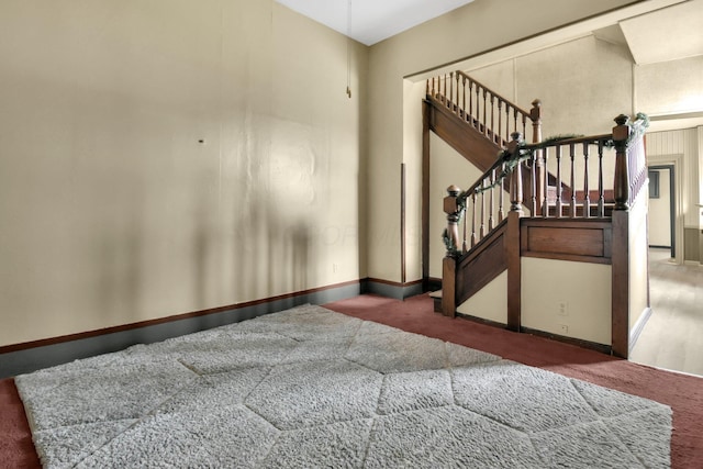 view of carpeted foyer entrance