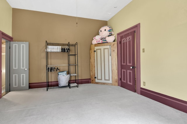 unfurnished bedroom with light colored carpet