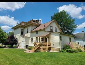 rear view of house with a yard