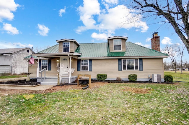 view of front of home with central AC, a porch, and a front yard