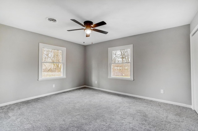 carpeted empty room with ceiling fan