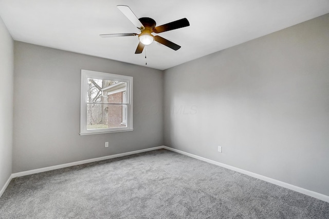 spare room featuring carpet floors and ceiling fan