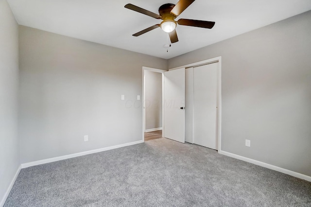 unfurnished bedroom with carpet floors, a closet, and ceiling fan