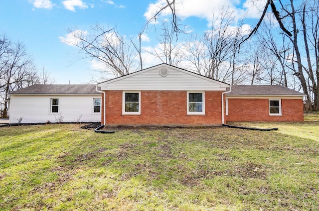 rear view of house with a yard