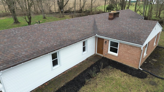 view of side of home featuring a lawn