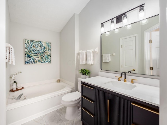 bathroom featuring vanity, a bathtub, toilet, and a textured ceiling