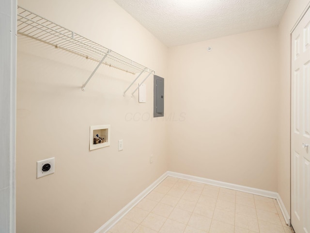 laundry area with hookup for an electric dryer, hookup for a washing machine, a textured ceiling, and electric panel