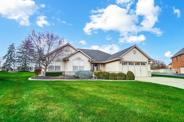 view of front of house featuring a garage and a front lawn