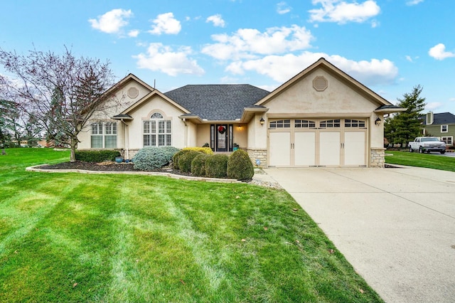 view of front of property with a garage and a front lawn