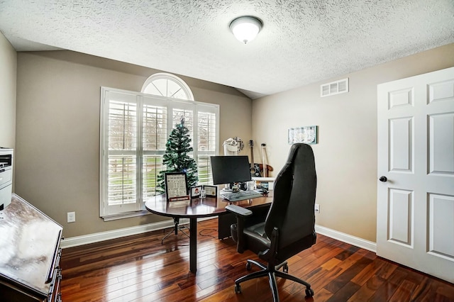 office with dark hardwood / wood-style flooring and a textured ceiling