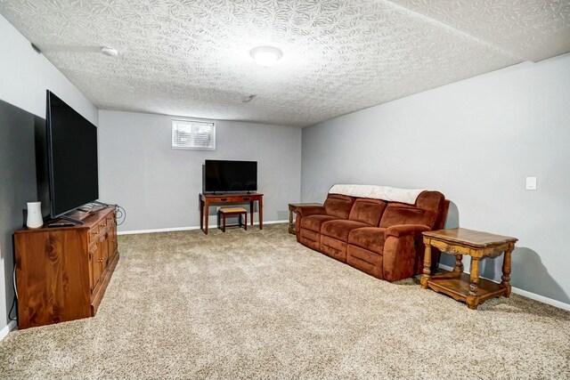 living room with carpet and a textured ceiling