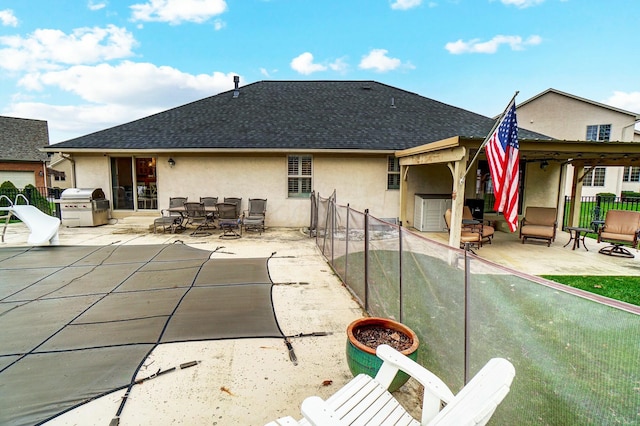 back of property with a patio area