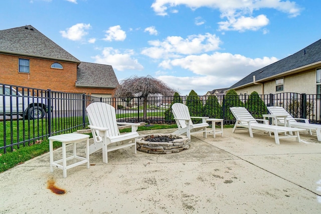 view of patio / terrace featuring an outdoor fire pit