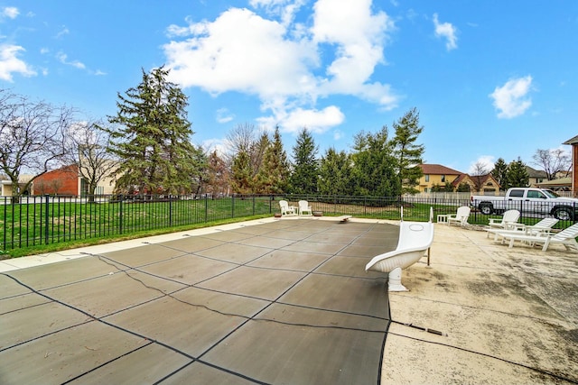 view of pool featuring a lawn and a patio area