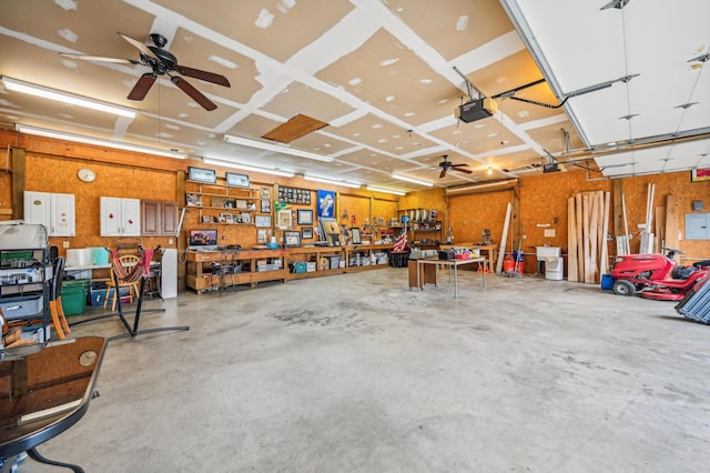 garage featuring a workshop area and a garage door opener