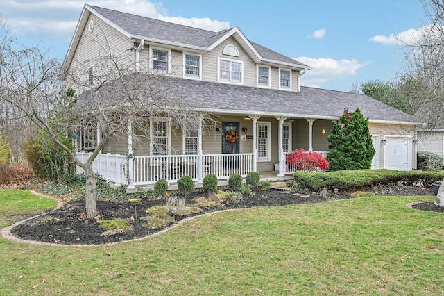 farmhouse-style home featuring covered porch, a garage, and a front lawn