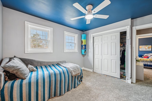 bedroom with ceiling fan and light colored carpet