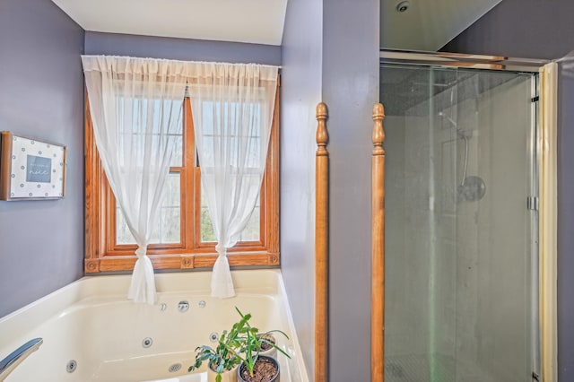 bathroom featuring separate shower and tub