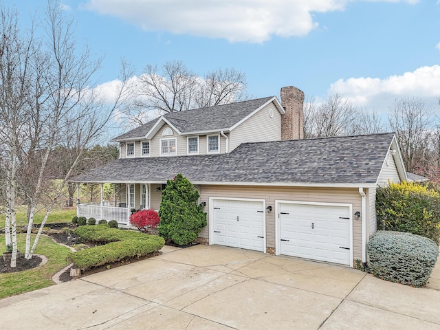 view of front of home featuring covered porch and a garage