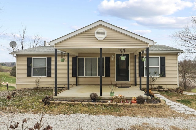 view of front of property with a porch and a patio