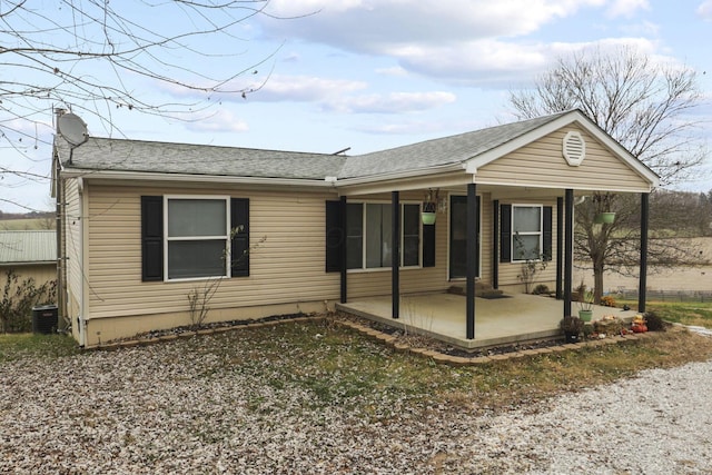 view of front of property featuring a patio area and central AC