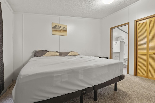 carpeted bedroom featuring a textured ceiling