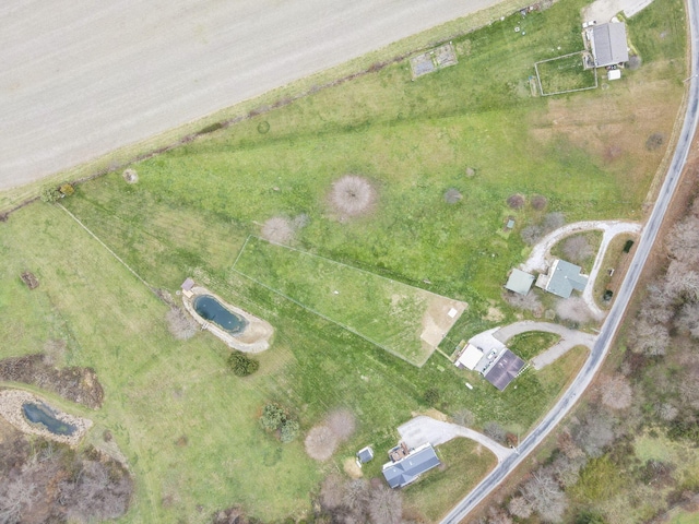 birds eye view of property with a rural view