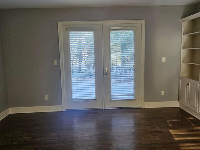 doorway to outside with dark hardwood / wood-style flooring, french doors, and built in features