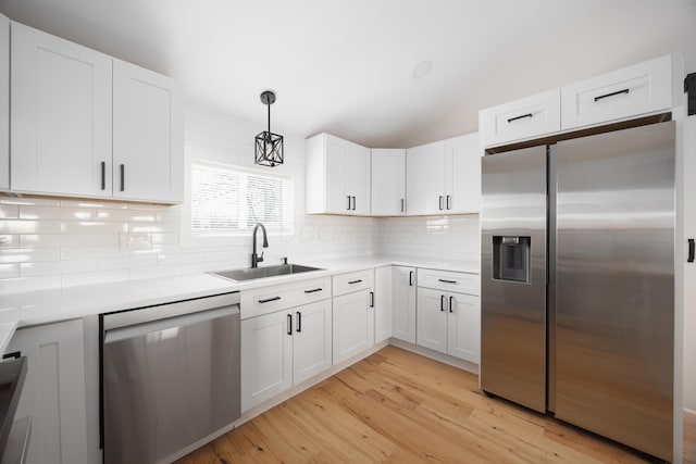 kitchen with white cabinets, stainless steel appliances, and sink