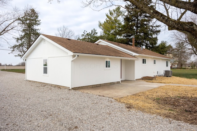 rear view of house featuring a patio and central AC unit