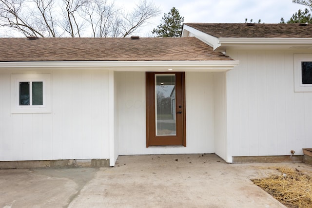 view of exterior entry featuring a patio