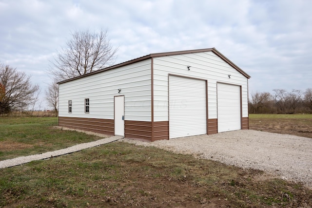 garage featuring a yard