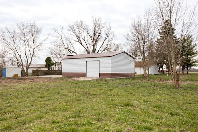 view of outdoor structure with a lawn