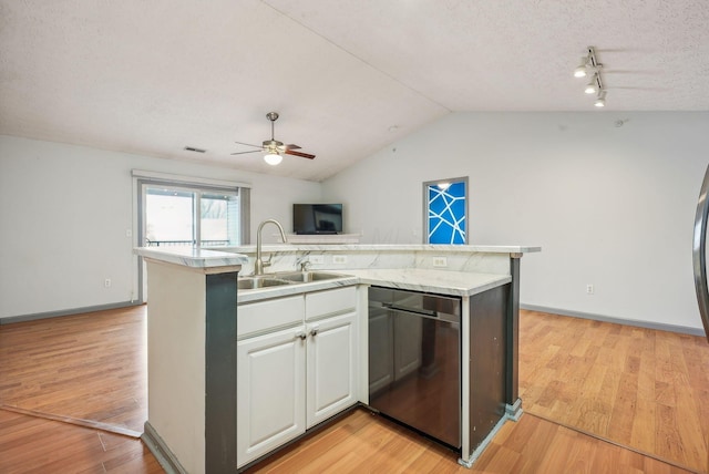 kitchen with white cabinets, light hardwood / wood-style floors, and sink